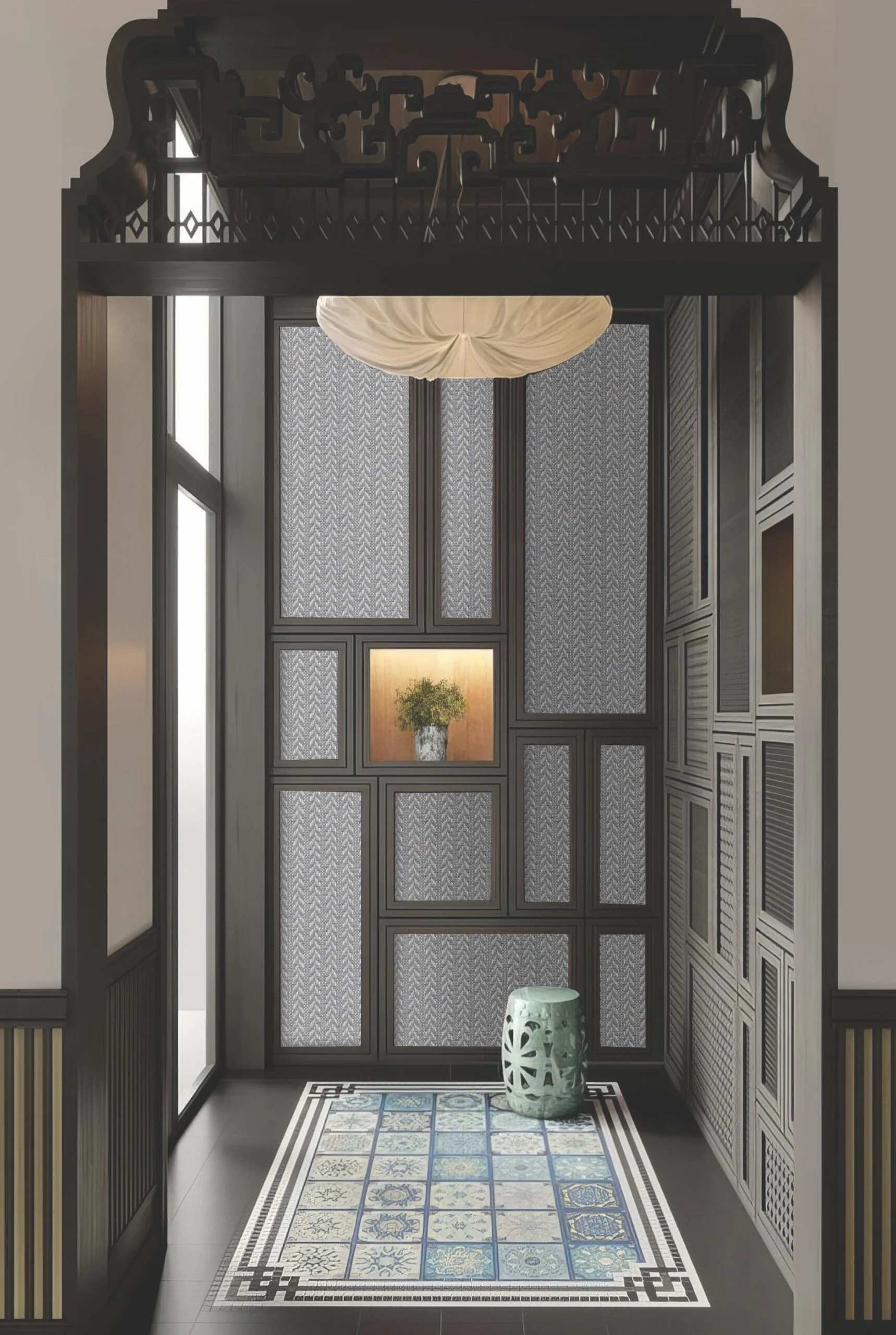 Ornate dark wood doorway framing a room with patterned wallpaper, a blue tiled rug, and a light blue garden stool.
