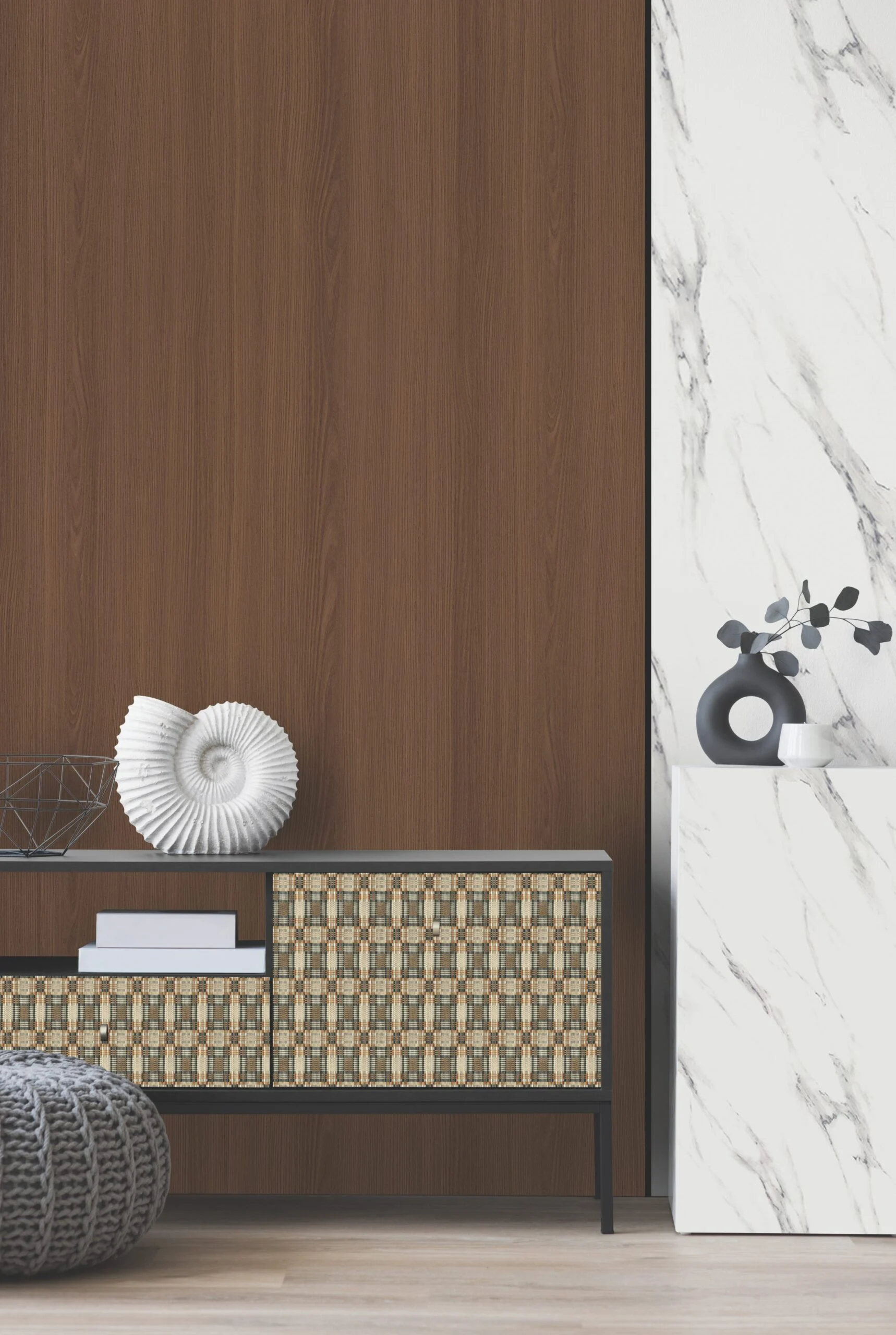 Modern sideboard with woven door panels, a large white shell, and a grey knit pouf against wood and marble walls.