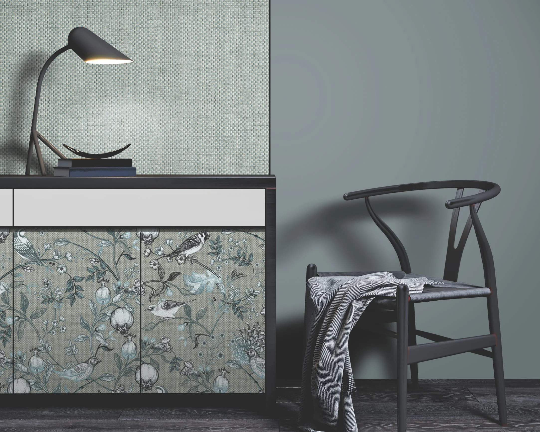 Modern sideboard with bird-patterned doors, a black desk lamp, and a black chair with a cloth drape.